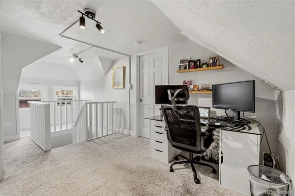 a view of a workspace with furniture and a couch