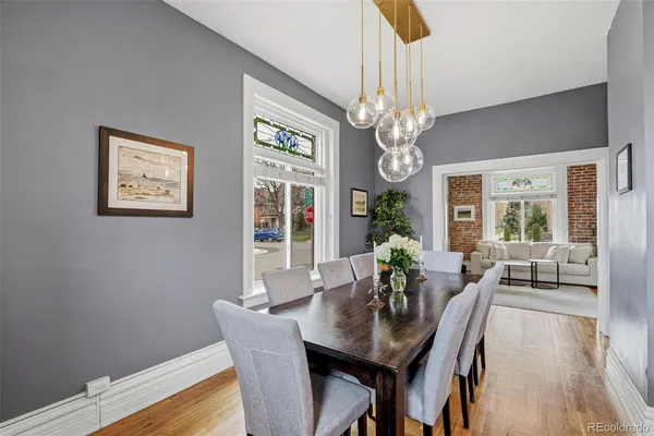 a view of a dining room with furniture window and wooden floor