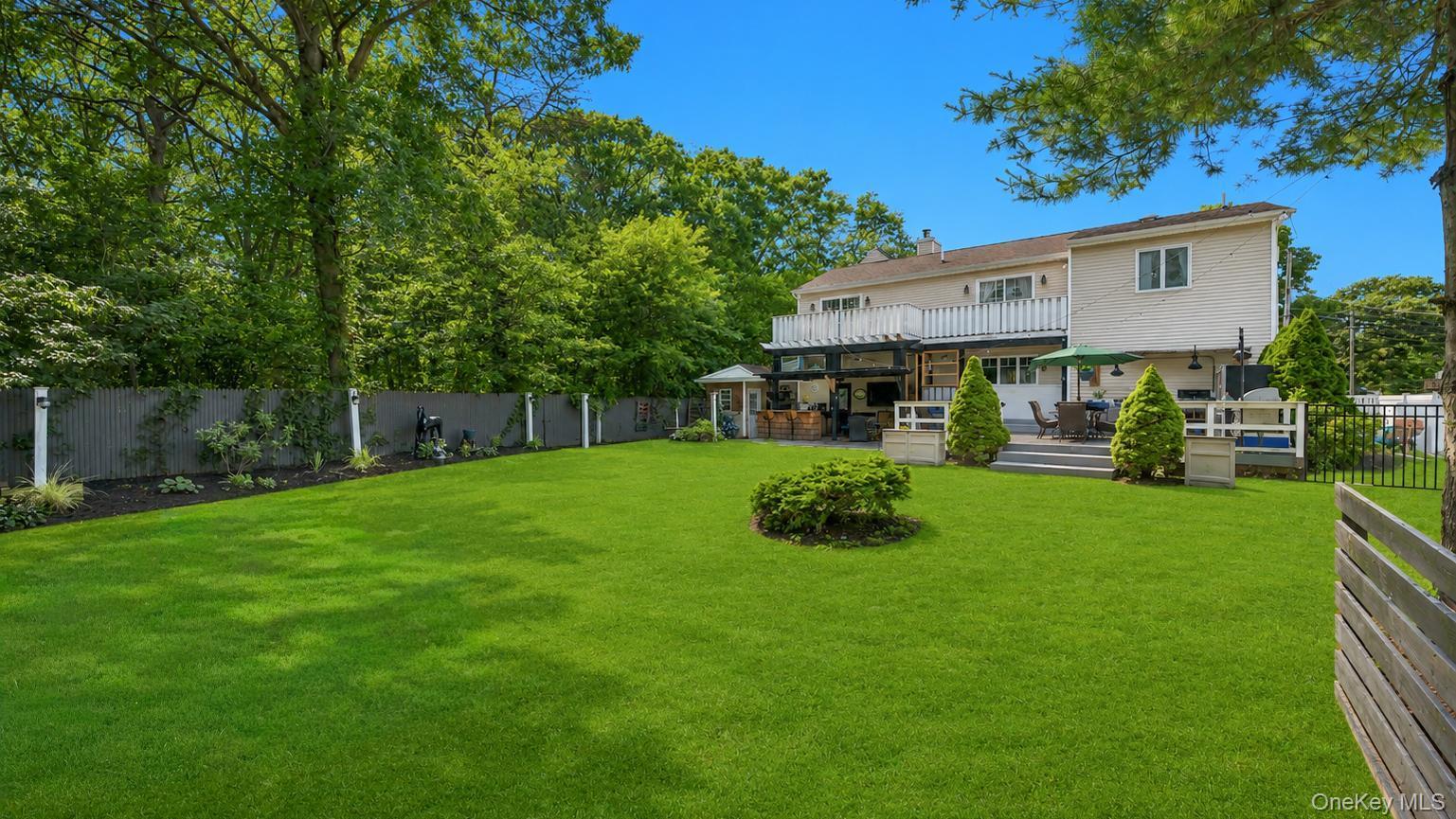 19 Joan Road Bay Shore, NY 11706 - Photo 44 of 50 Expansive green lawn with mature perimeter trees