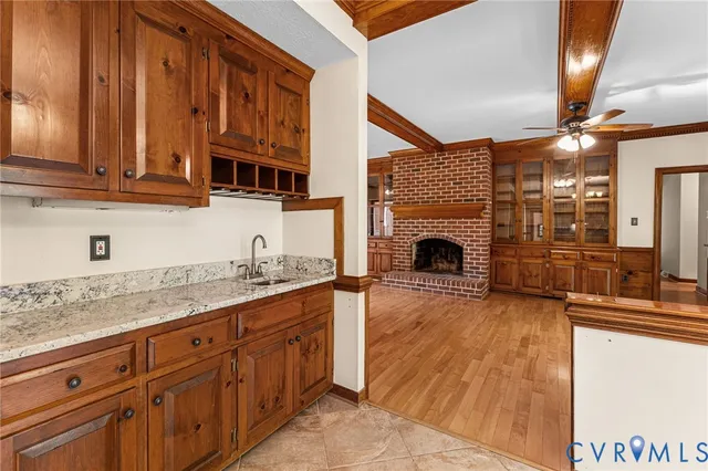 a kitchen with stainless steel appliances granite countertop a stove sink and cabinets