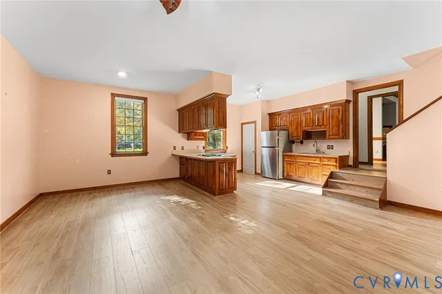 a view of kitchen with furniture and wooden floor