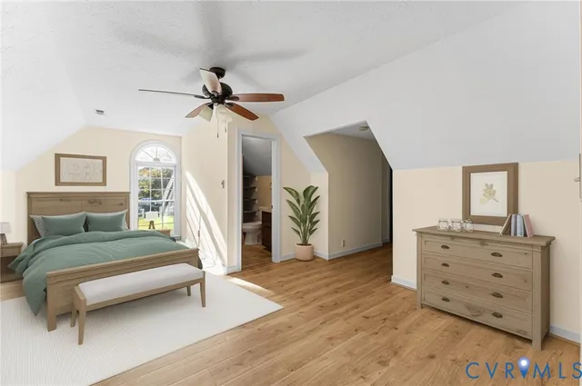 a view of a room with wooden floor and white walls