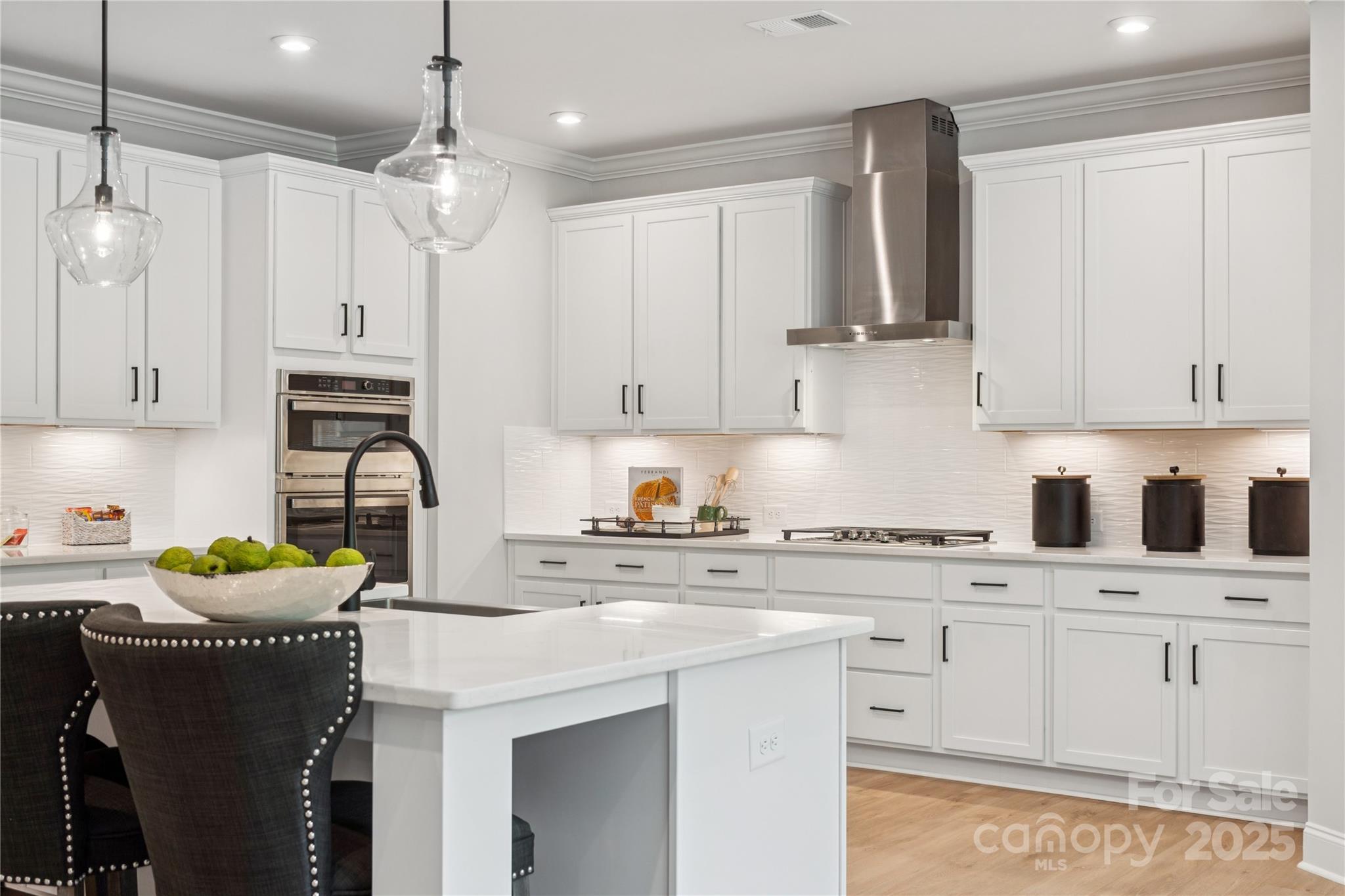 136 Balboa Street Matthews, NC 28104 - Photo 14 of 47 a kitchen with stainless steel appliances granite countertop a sink stove and cabinets