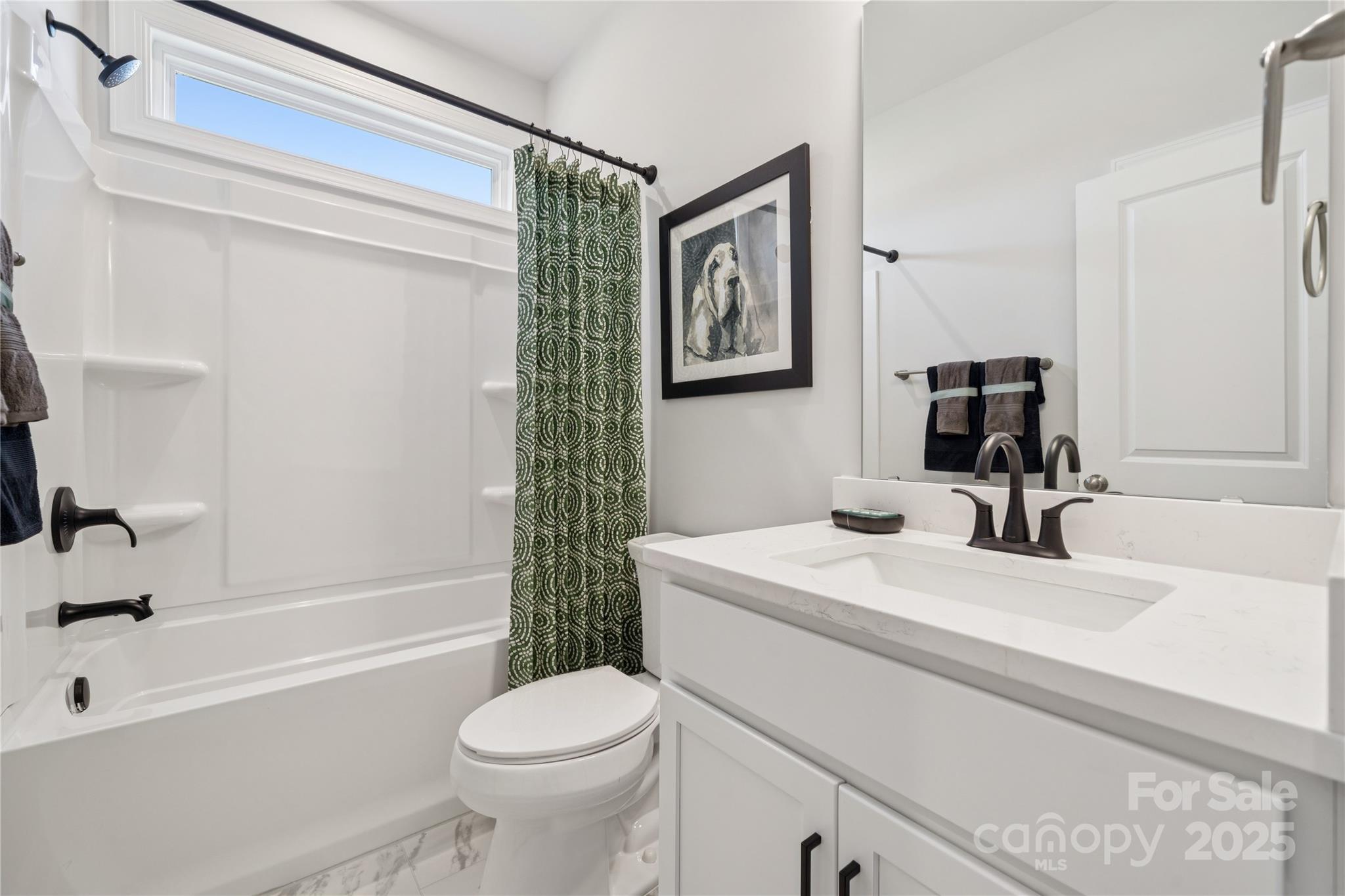 136 Balboa Street Matthews, NC 28104 - Photo 18 of 47 a bathroom with a sink a toilet and a bathtub