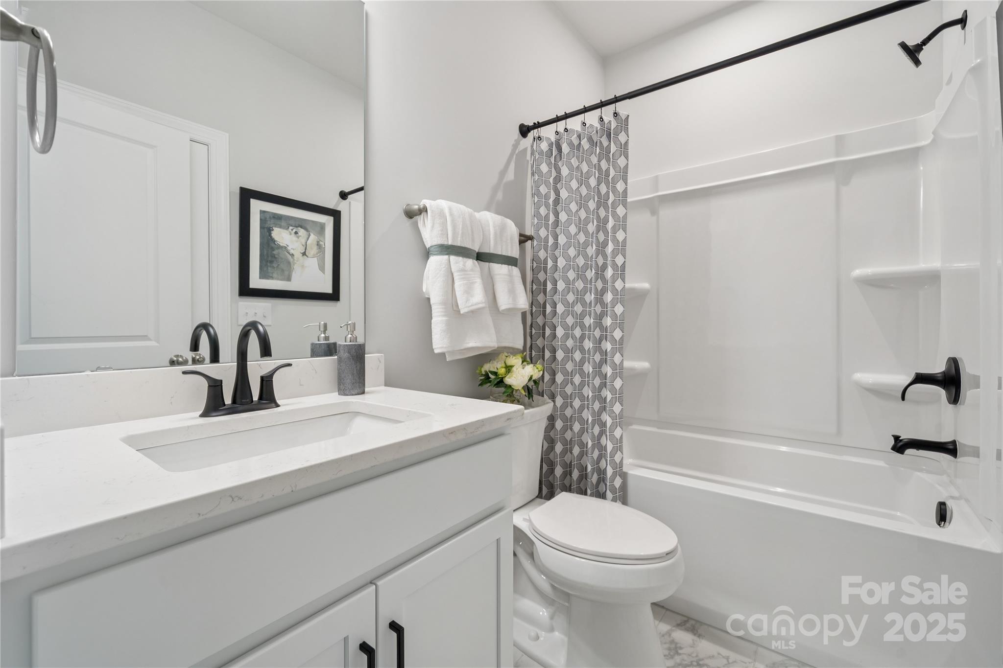 136 Balboa Street Matthews, NC 28104 - Photo 20 of 47 a bathroom with a sink toilet and shower