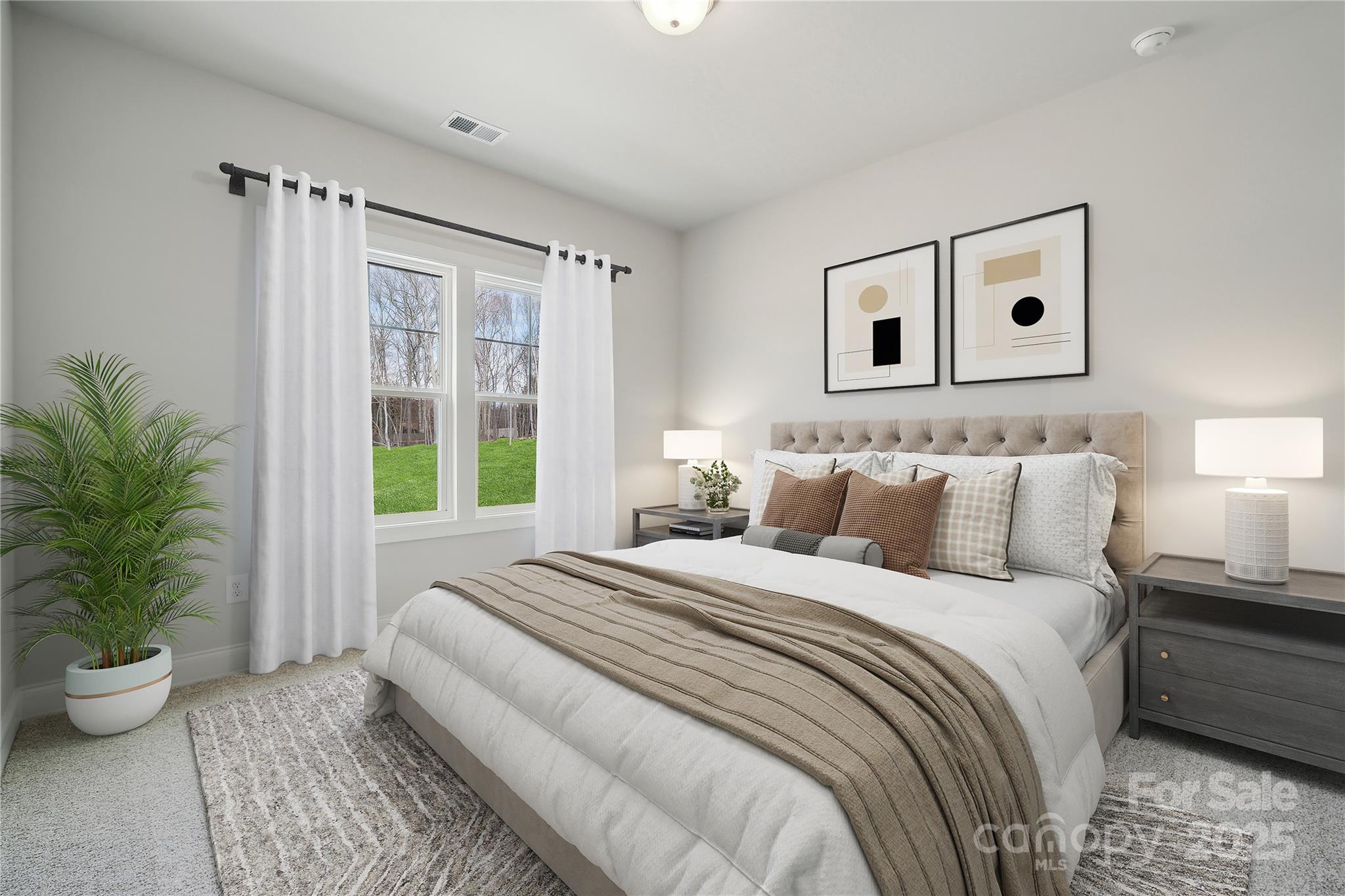 136 Balboa Street Matthews, NC 28104 - Photo 22 of 47 a bedroom with a large bed and a potted plant