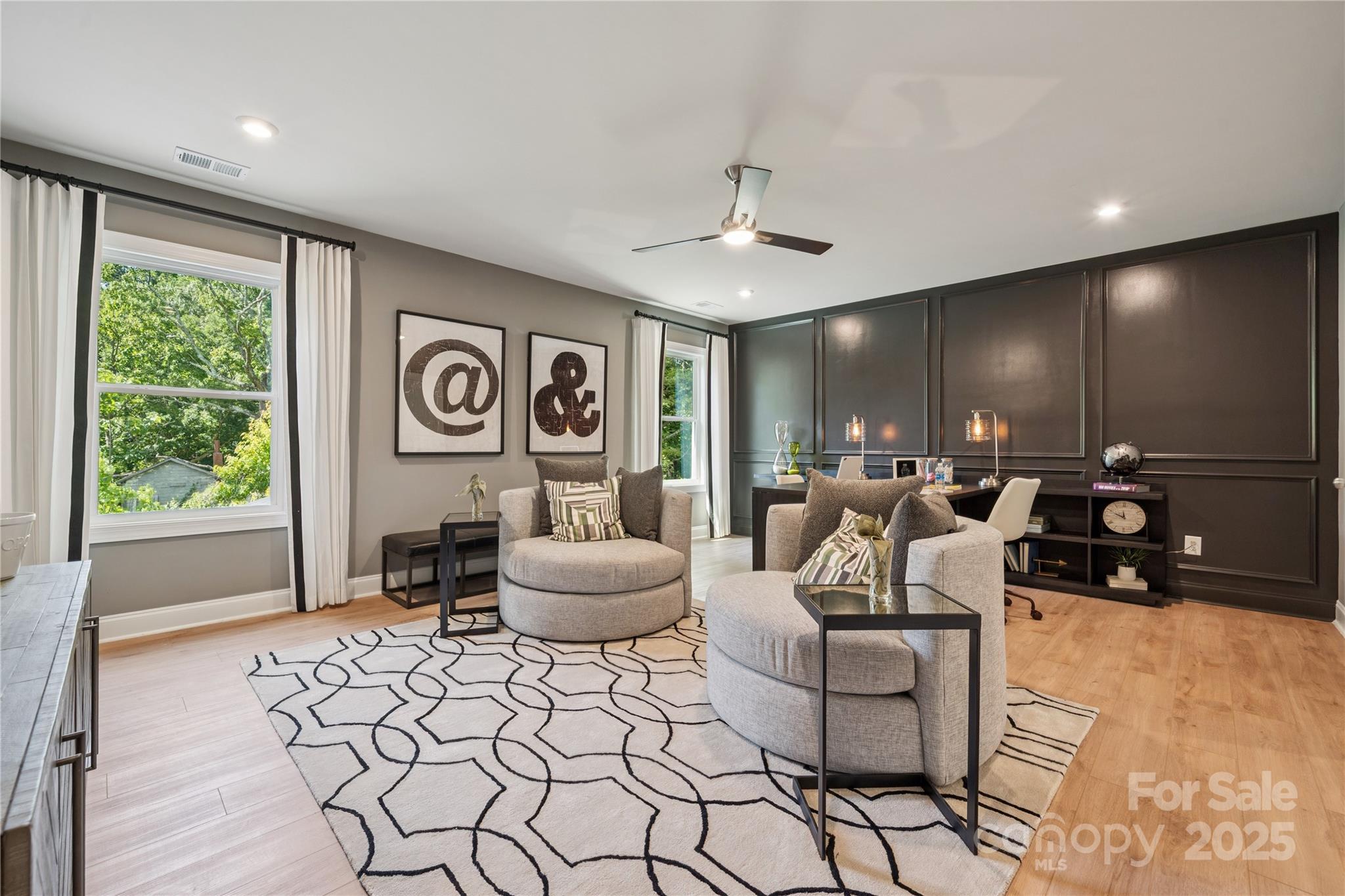 136 Balboa Street Matthews, NC 28104 - Photo 23 of 47 a living room with furniture and a large window