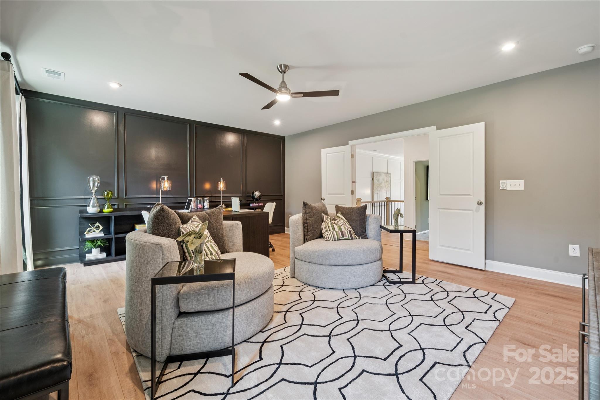 136 Balboa Street Matthews, NC 28104 - Photo 24 of 47 a living room with furniture and a potted plant