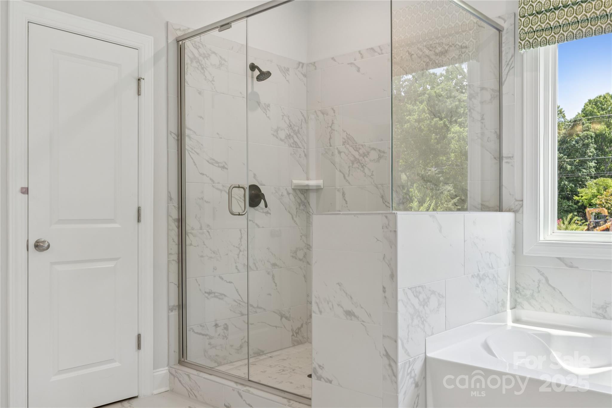 136 Balboa Street Matthews, NC 28104 - Photo 9 of 47 a bathroom with a shower and a sink