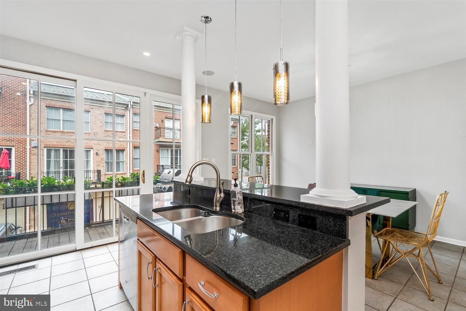 2331 Boston Street, Unit 3 Baltimore, MD 21224 - Photo 14 of 33 Floor to ceiling windows bring light into kitchen