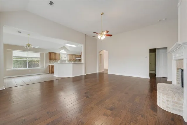 a view of a kitchen with a dishwasher cabinets and wooden floor