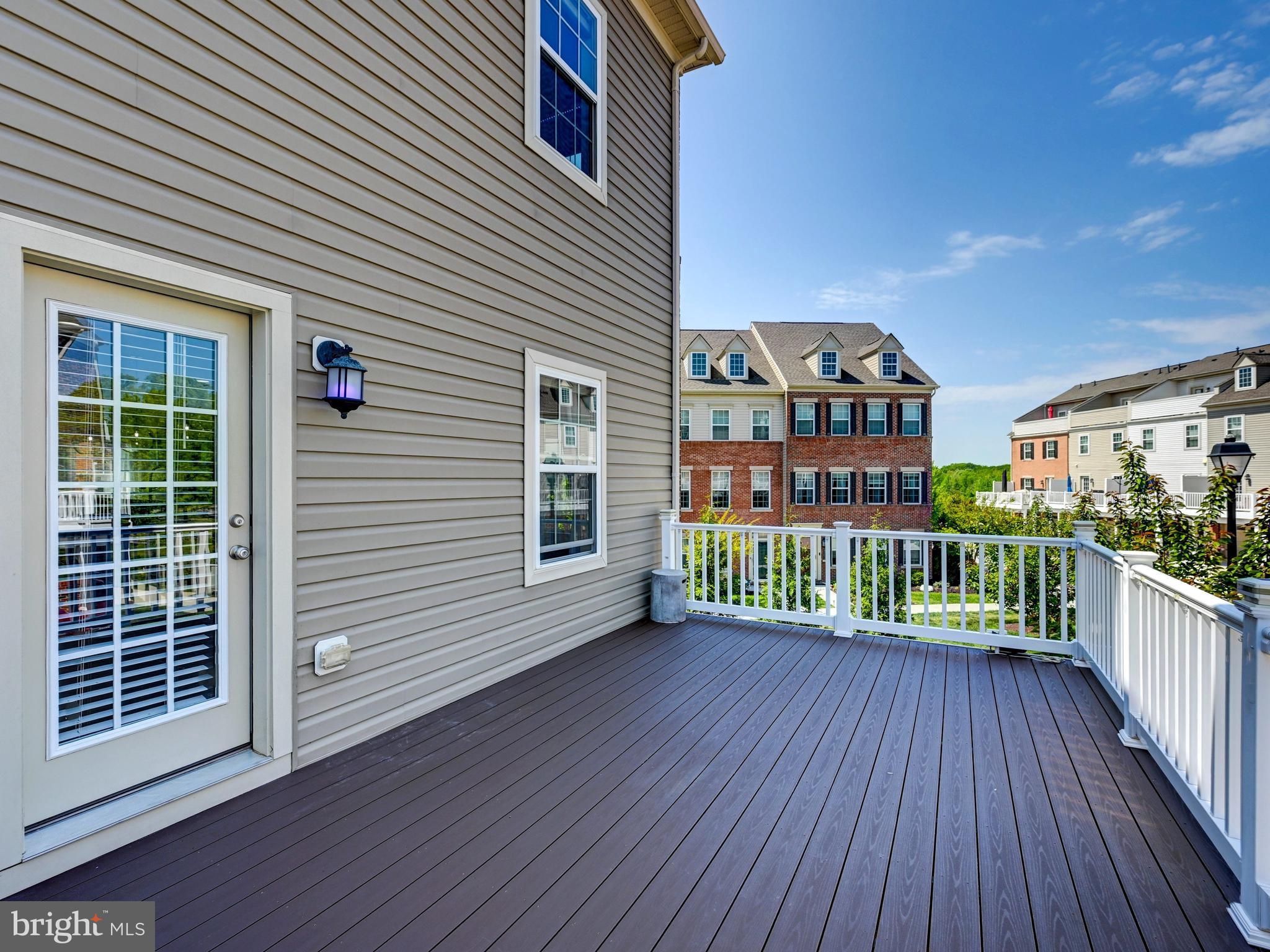 5000 John Buck Avenue Perry Hall, MD 21128 - Photo 14 of 41 a view of a balcony with wooden floor and fence