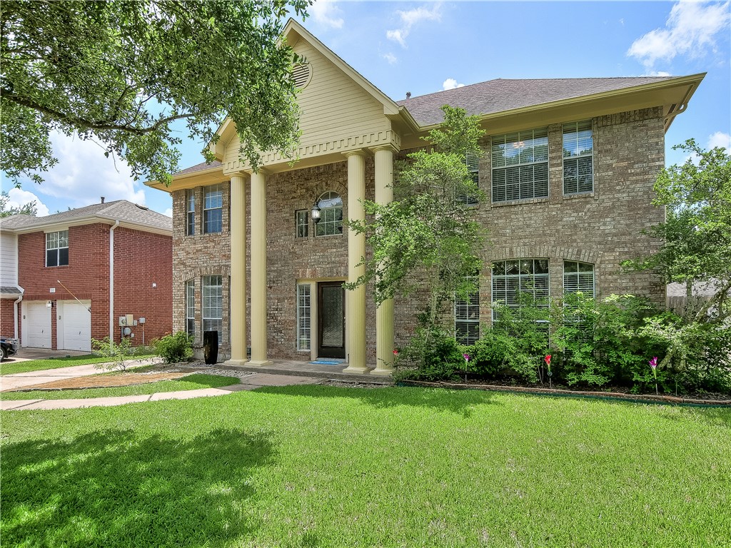 5916 Rickerhill Lane Austin, TX 78739 - Photo 1 of 1 a front view of a house with a yard