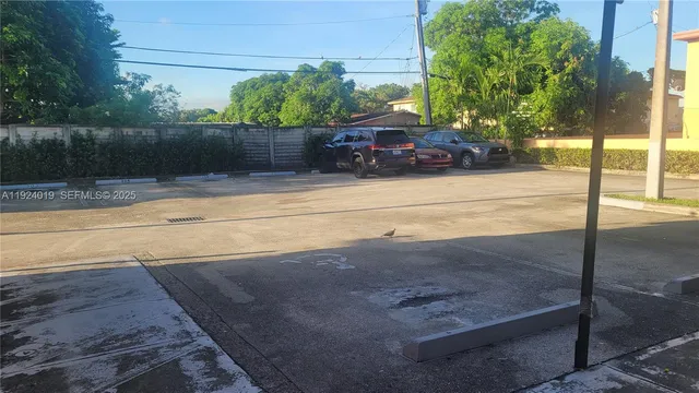 a view of a street with cars