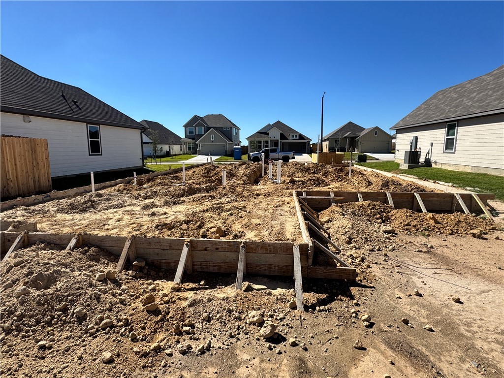 2422 Rooke Road Bryan, TX 77807 - Photo 3 of 12 a view of roof with wooden fence
