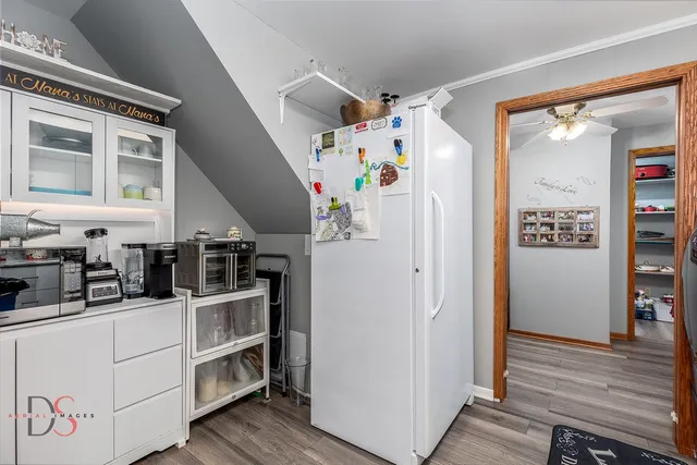 a kitchen with stainless steel appliances refrigerator and cabinets