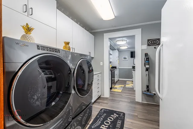 a view of a hallway with washer and dryer