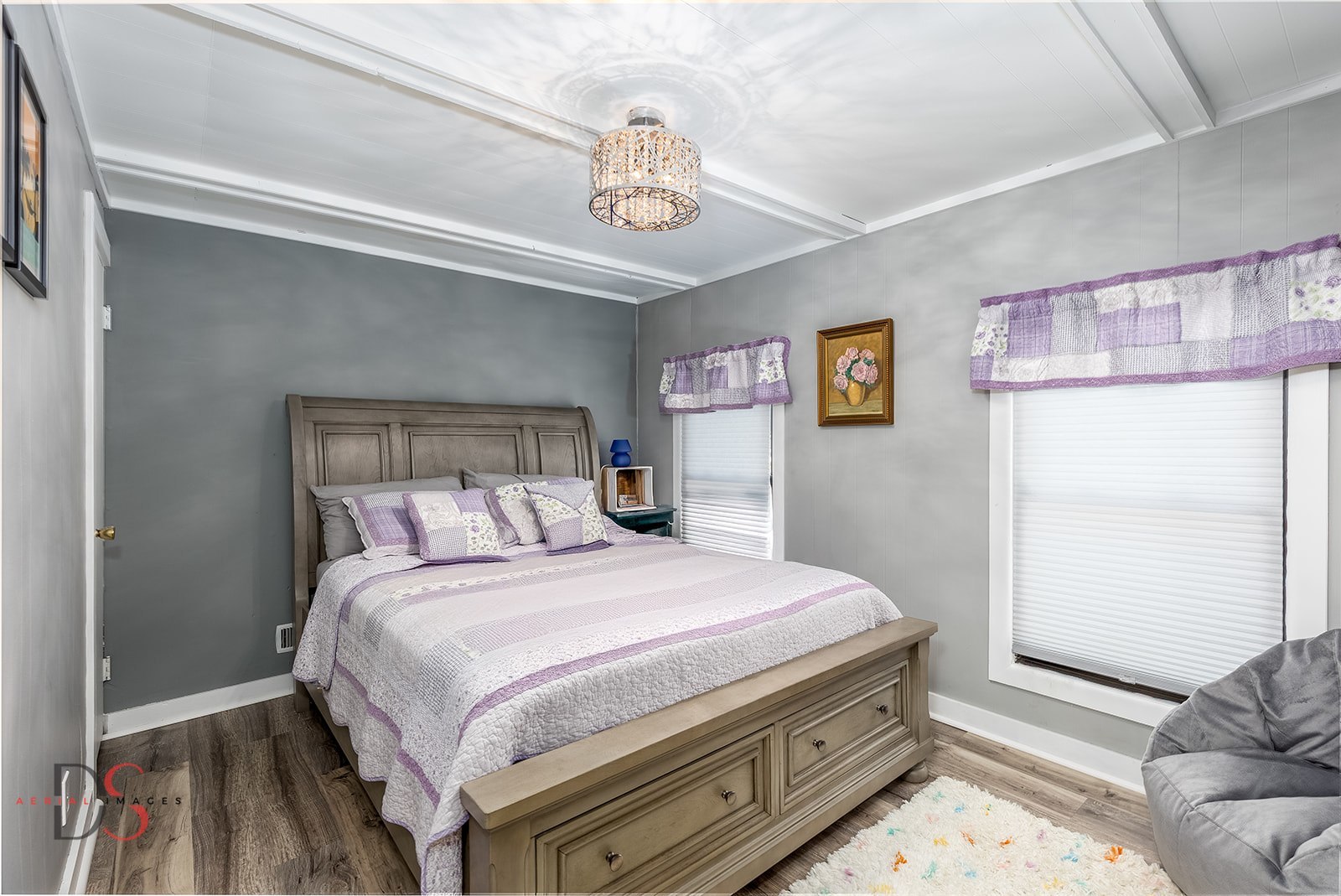 527 East Main Street Ottawa, IL 61350 - Photo 24 of 44 a bedroom with a bed and a chandelier