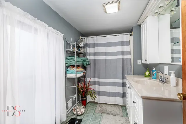 a kitchen with a refrigerator and a sink