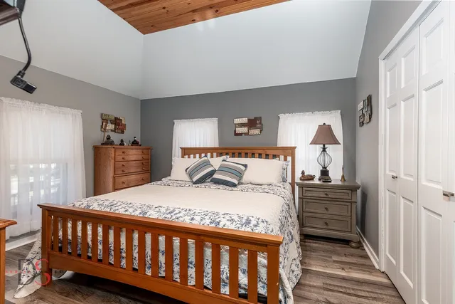 a bedroom with a bed and a dresser