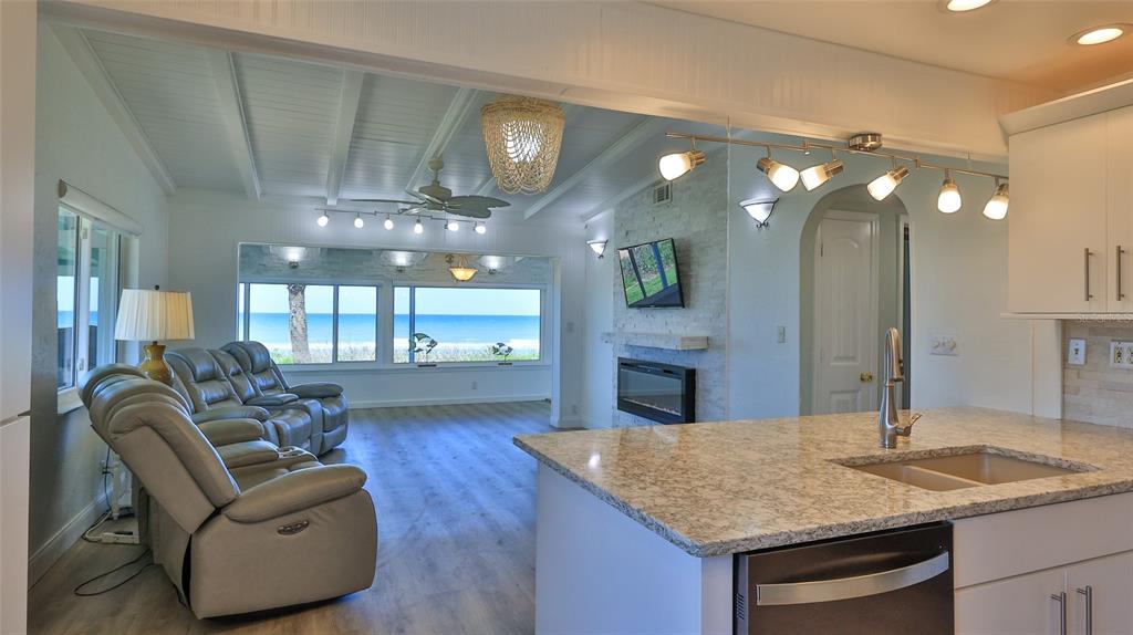 8 Ocean Dunes Drive Ormond Beach, FL 32176 - Photo 11 of 55 a living room with furniture and chandelier