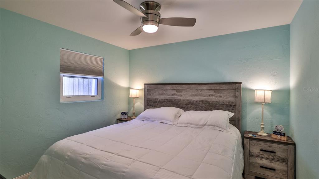 8 Ocean Dunes Drive Ormond Beach, FL 32176 - Photo 13 of 55 a bedroom with a bed and a window