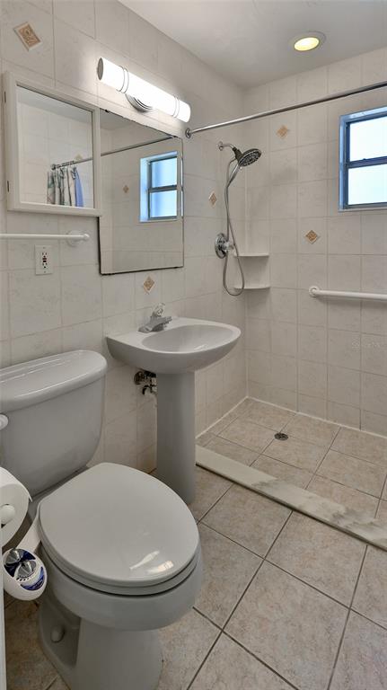 8 Ocean Dunes Drive Ormond Beach, FL 32176 - Photo 16 of 55 a bathroom with a toilet sink and shower