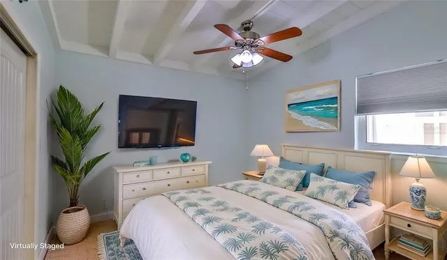 an empty room with a ceiling fan