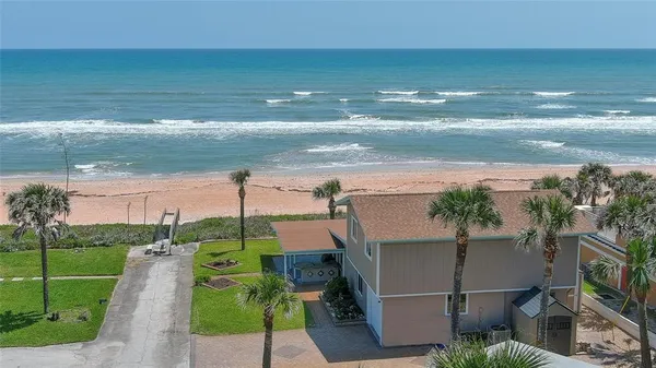 a view of a street with an ocean