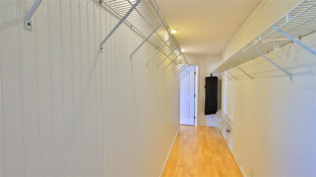 8 Ocean Dunes Drive Ormond Beach, FL 32176 - Photo 27 of 55 a view of a hallway with wooden floor