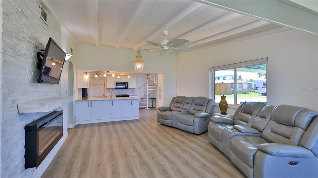 8 Ocean Dunes Drive Ormond Beach, FL 32176 - Photo 34 of 55 a living room with furniture and a fireplace
