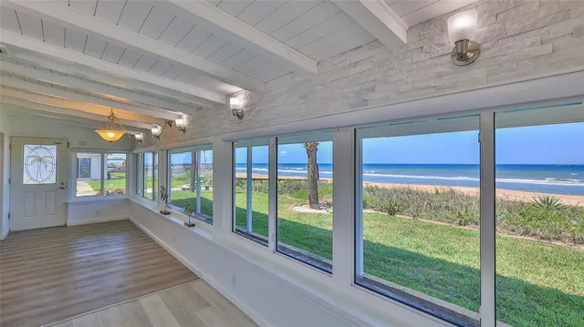 a view of a patio with table and chairs and potted plants