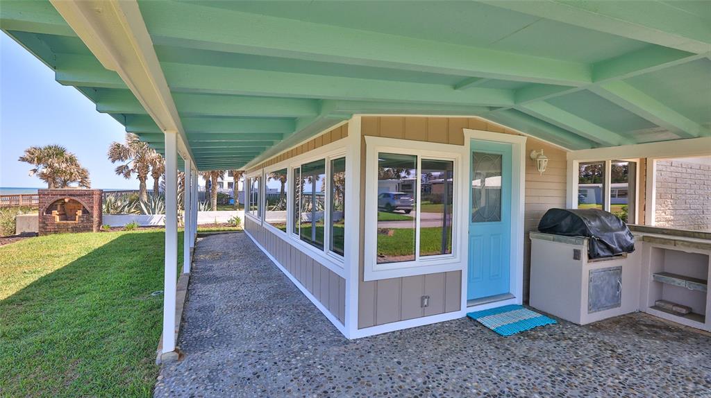 8 Ocean Dunes Drive Ormond Beach, FL 32176 - Photo 37 of 55 a view of a porch with furniture and garden