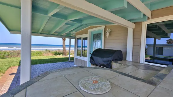 a view of a porch in front of a house