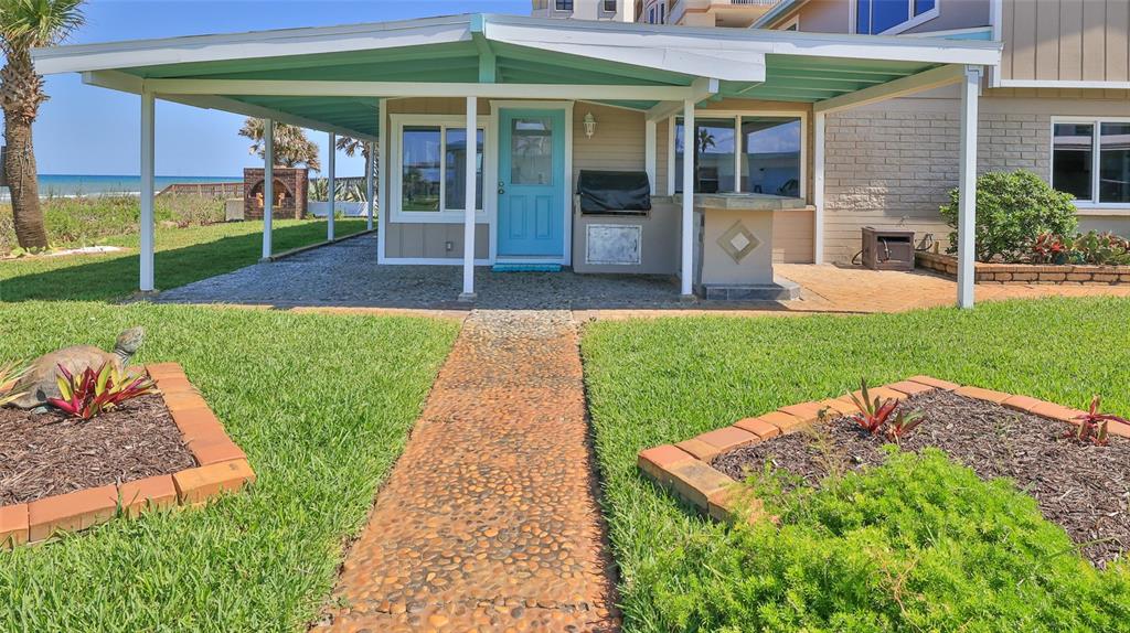 8 Ocean Dunes Drive Ormond Beach, FL 32176 - Photo 4 of 55 a view of a backyard with a garden and plants