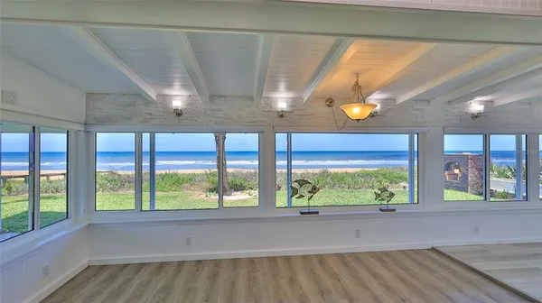 a view of room with furniture and window