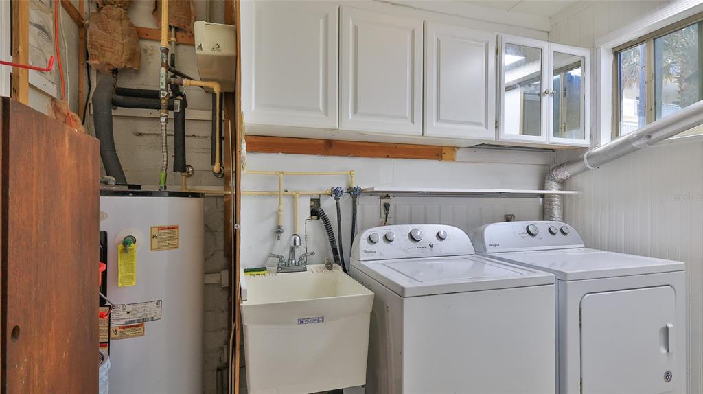 8 Ocean Dunes Drive Ormond Beach, FL 32176 - Photo 55 of 55 a utility room with dryer and washer