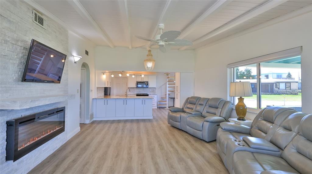 8 Ocean Dunes Drive Ormond Beach, FL 32176 - Photo 8 of 55 a living room with furniture and a fireplace