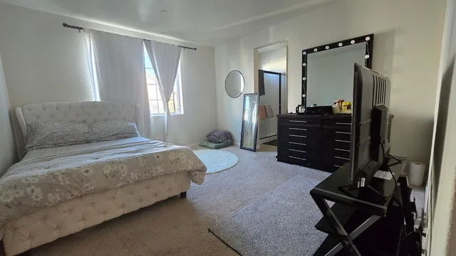 a kitchen with stainless steel appliances kitchen island granite countertop a sink stove and refrigerator