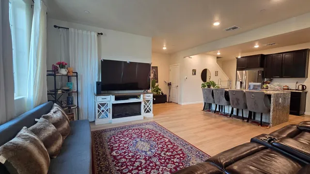 a kitchen with sink and refrigerator