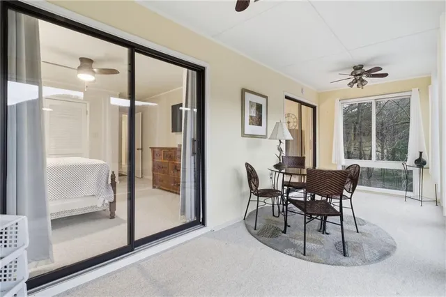 a dining room with furniture and window
