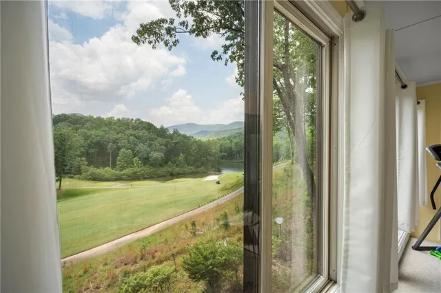 a view of balcony and yard