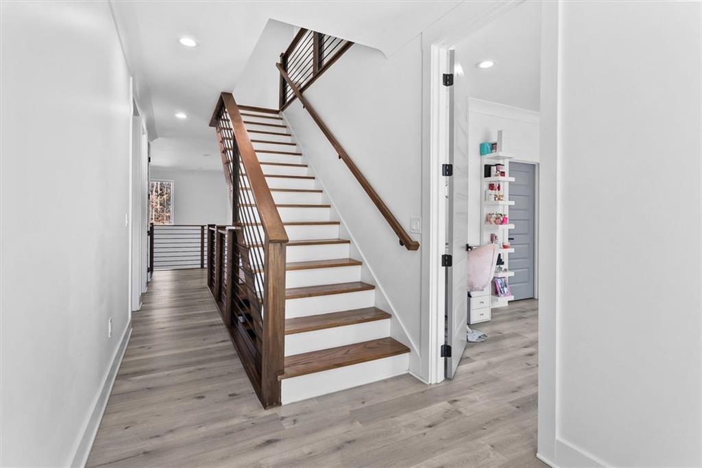 658 Rockbridge Road Northwest Lilburn, GA 30047 - Photo 19 of 61 a view of a hallway with wooden floor and entryway