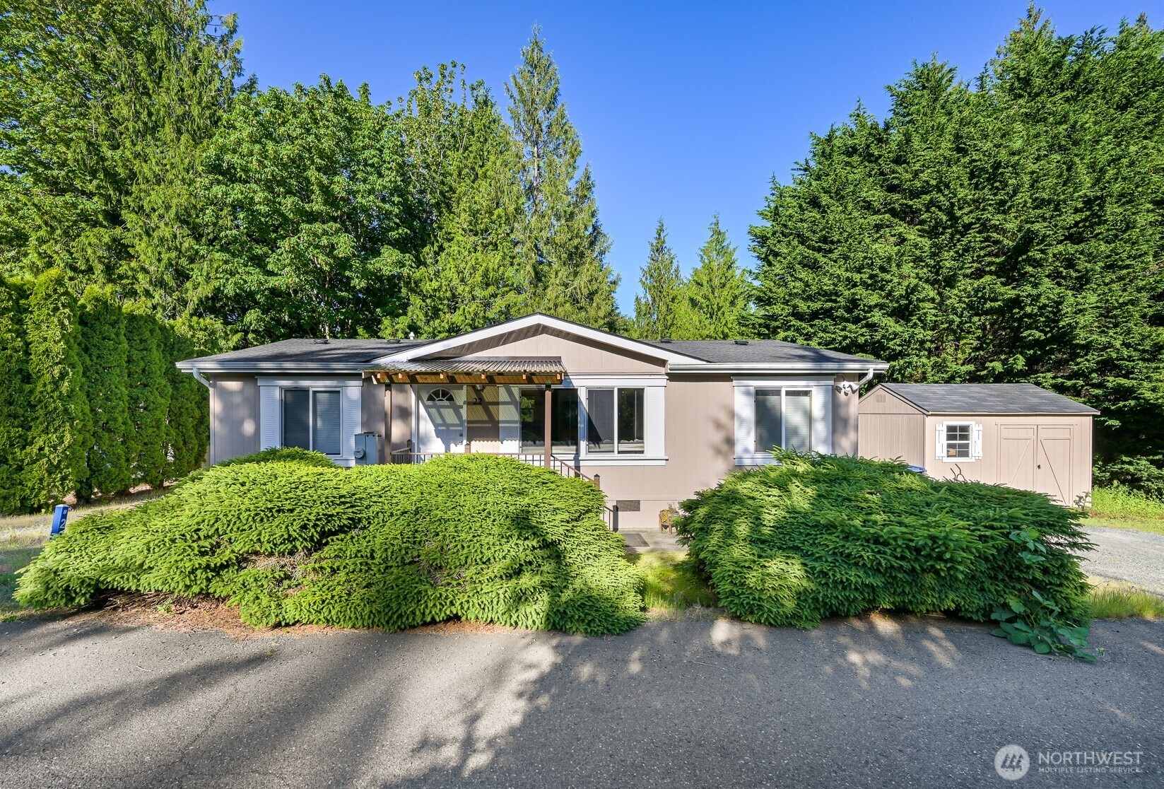 2174 Yew Street Road, Unit 22 Bellingham, WA 98229 - Photo 1 of 36 a front view of a house with a yard