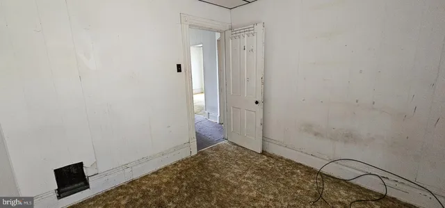 a view of an empty room and window