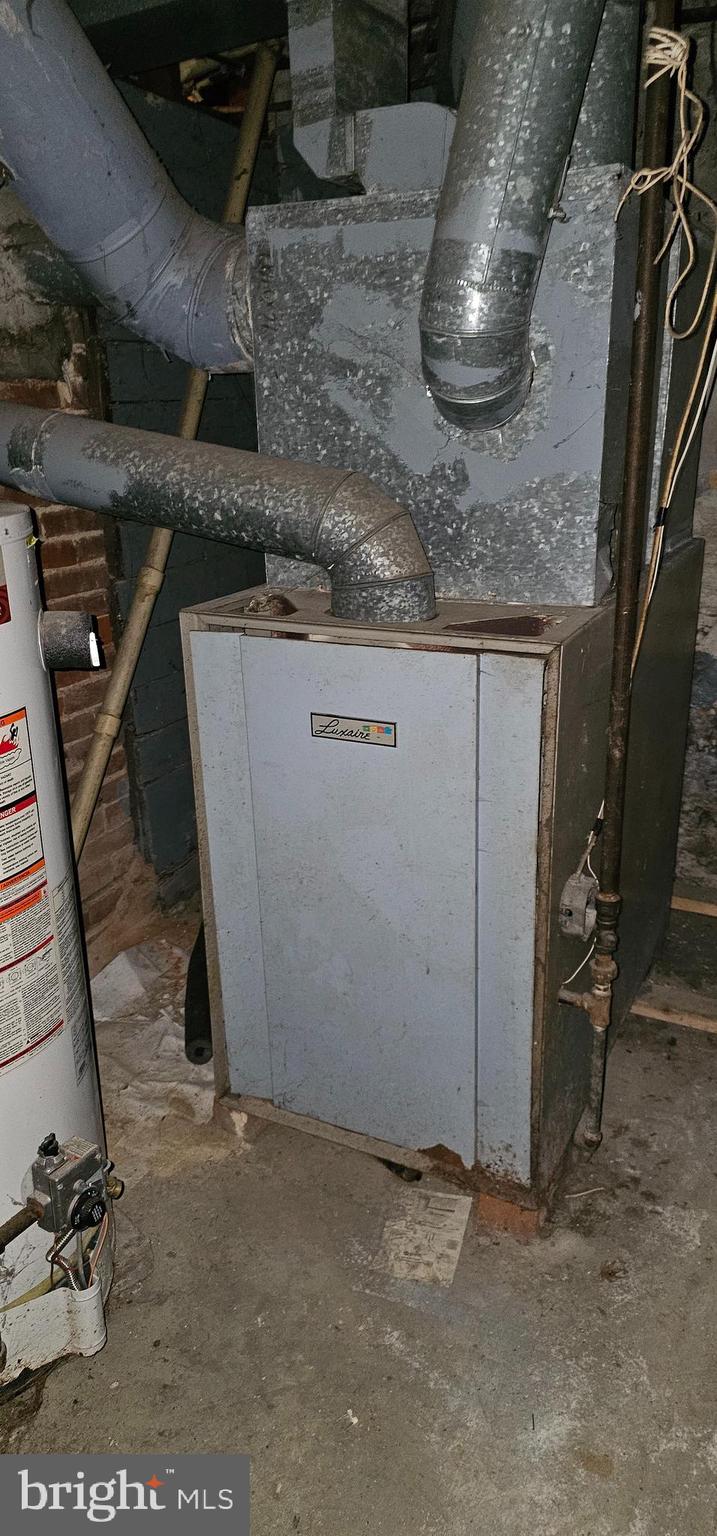 922-924 Von Lunen Road Johnstown, PA 15902 - Photo 30 of 54 a room with water heater and a wooden door