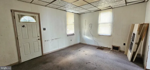 a utility room with cabinets washer and dryer