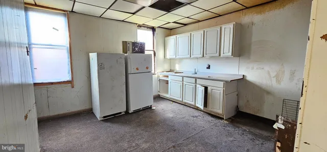 a utility room with cabinets