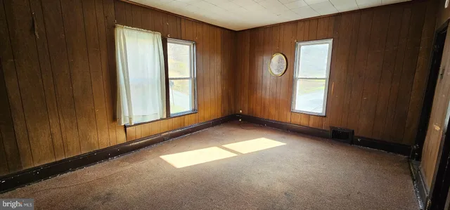 a view of a room with large windows