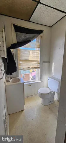 a view of an empty room and a window